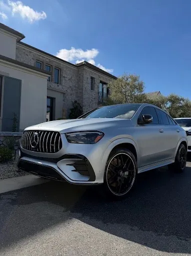 Silver Mercedes-AMG GLE Coupe detailed in front of a north Phoenix home